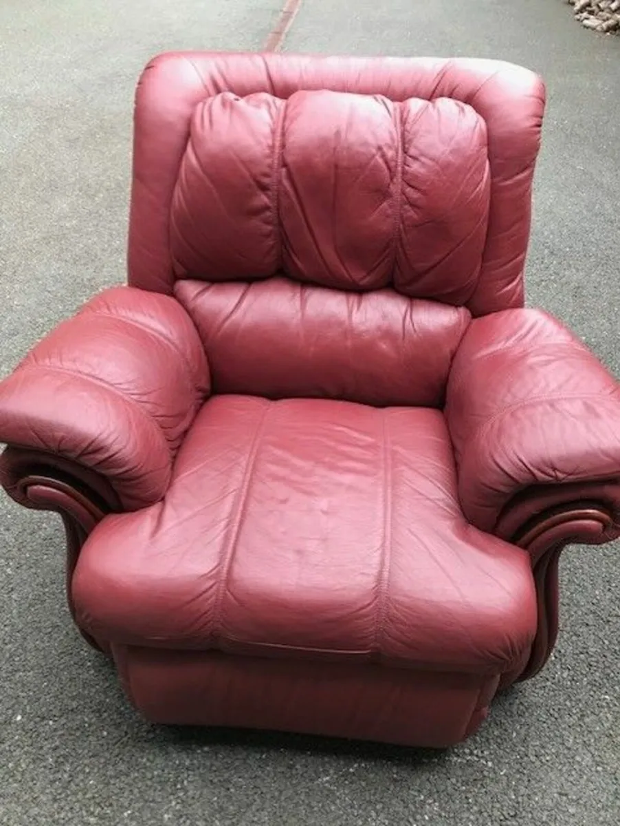 Reclining 1 seater  maroon coloured couch