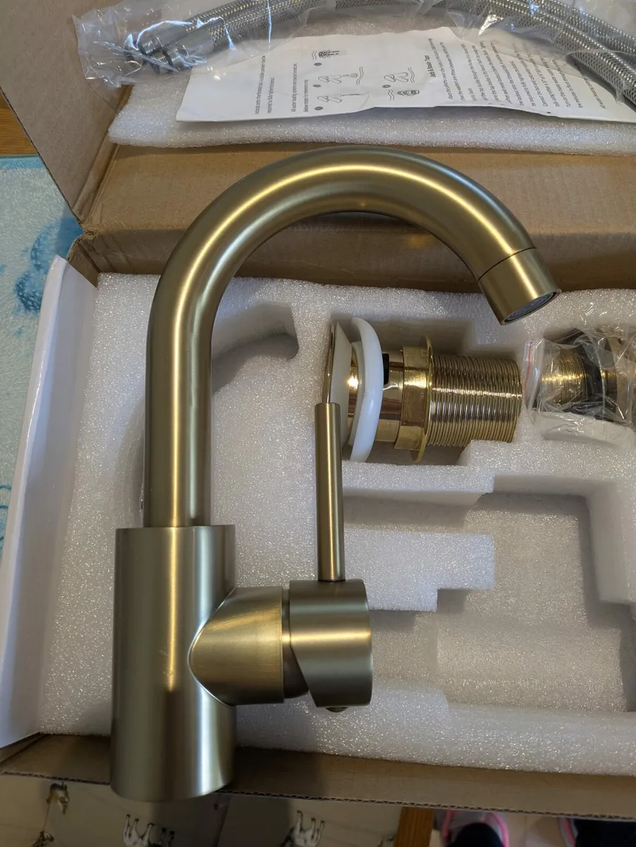 Gold bathroom tap - Image 1