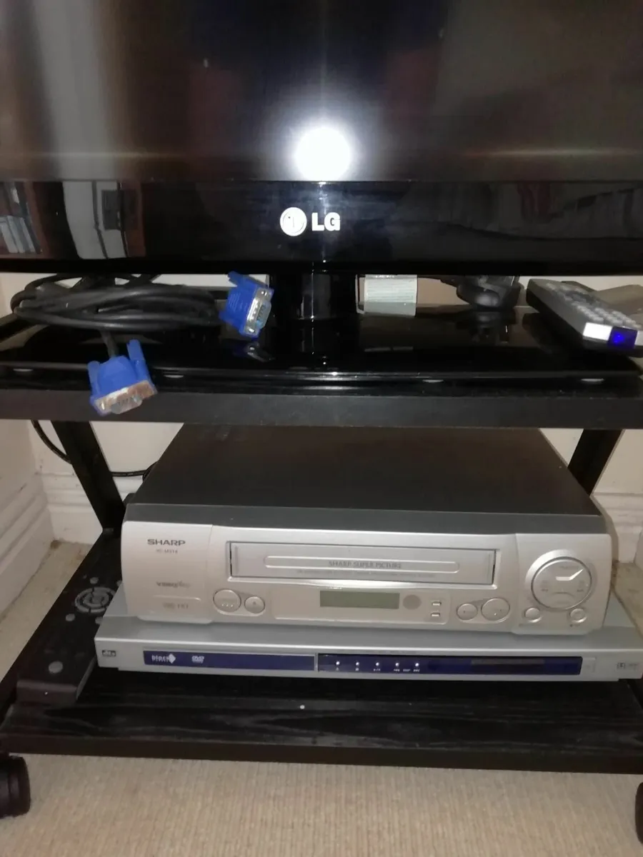 LG TV and Sharp DVD player combo on table - Image 2