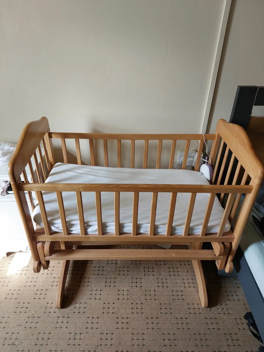 Swinging wooden cot