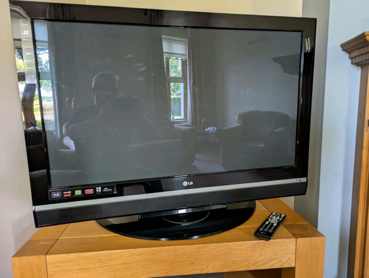 LG42" T.V + Stand + DVD player - Image 1