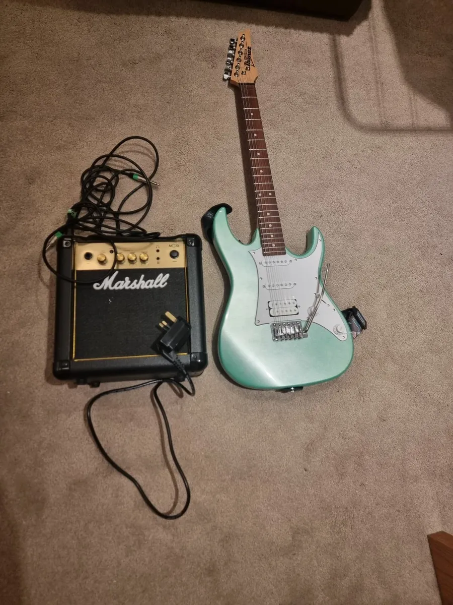Guitar with Marshal amplifier - Image 1