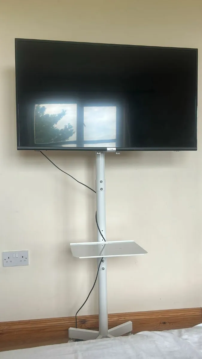 32-Inch Smart TV with Rolling White Stand - Image 1