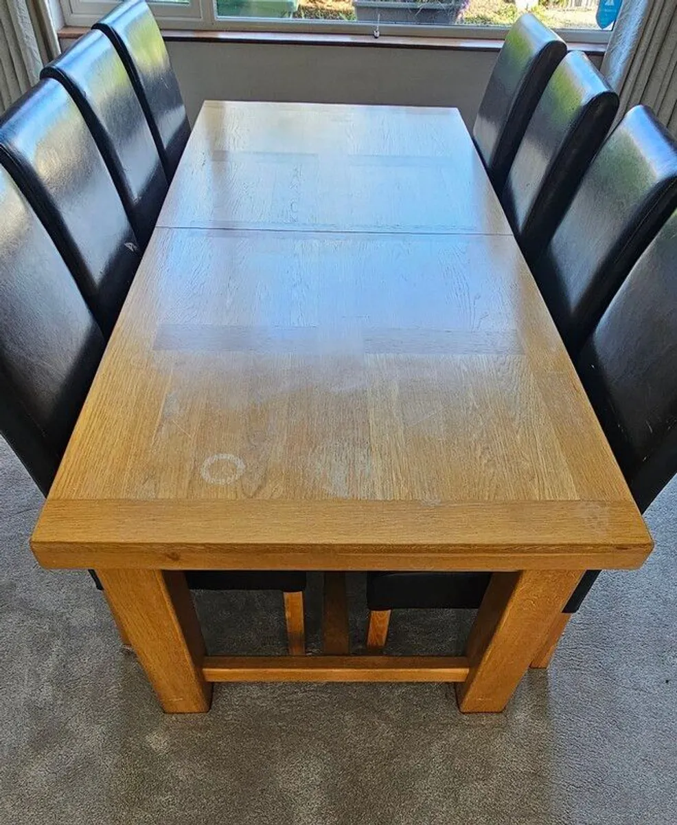 Very long and heavy Oak extendable to 10ft dining table with 8 chairs - Image 1