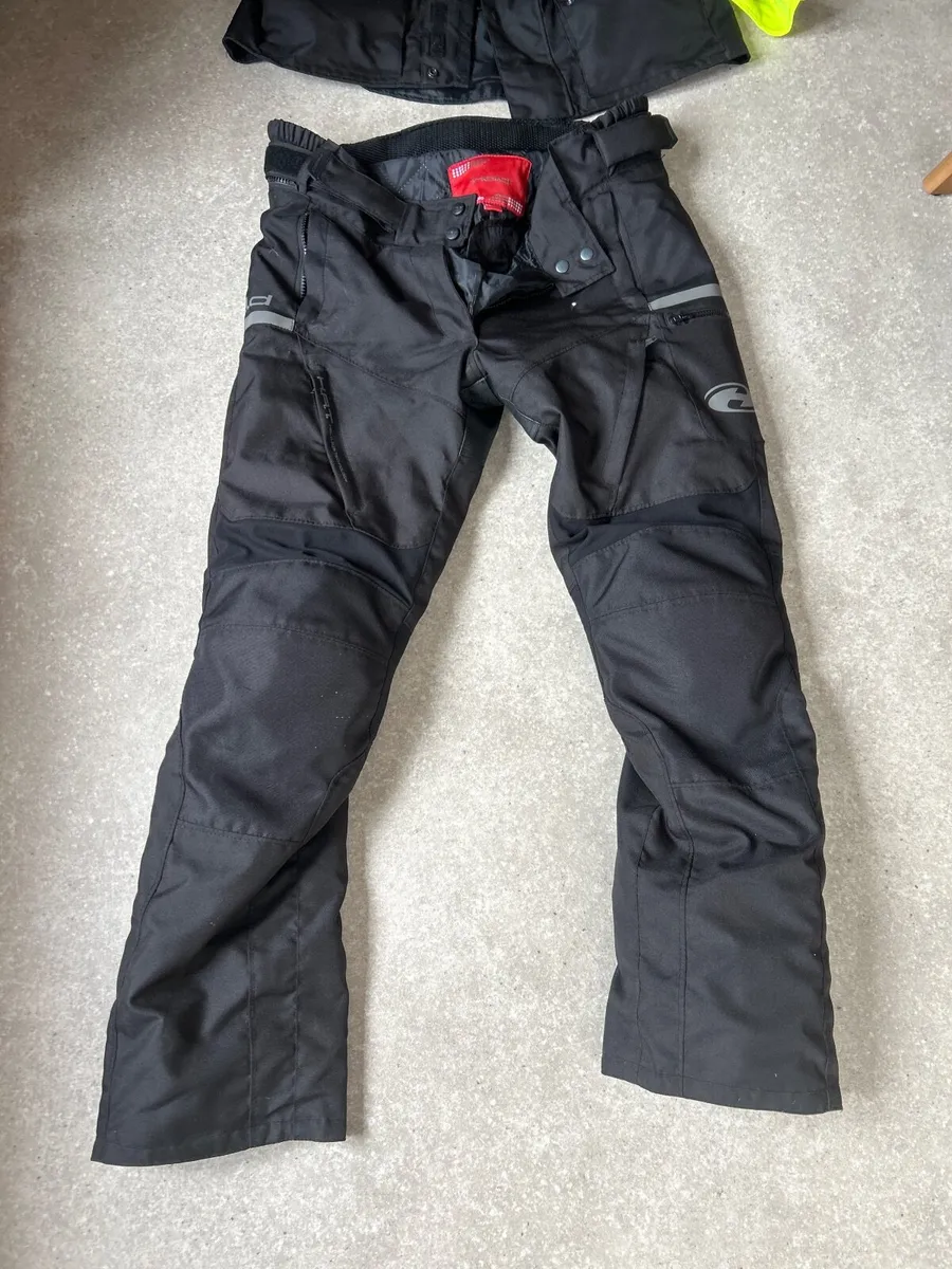 Motorcycle helmet  and waterproof jacket and pant - Image 1