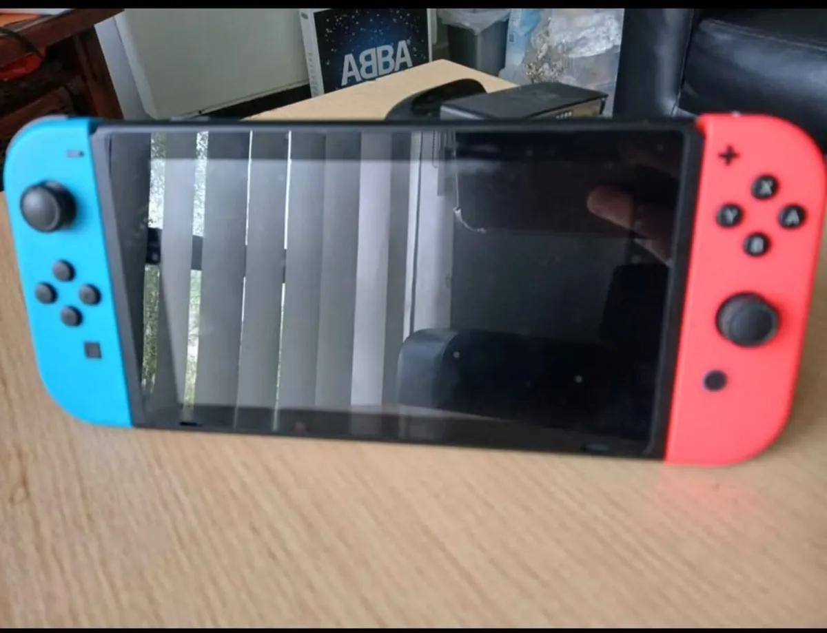 Nintendo Switch + Games - Image 1