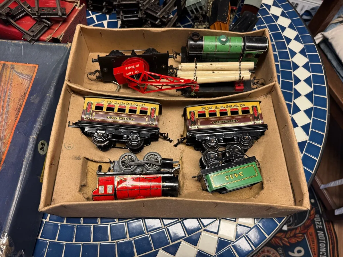 A collection of model trains and track - Image 1