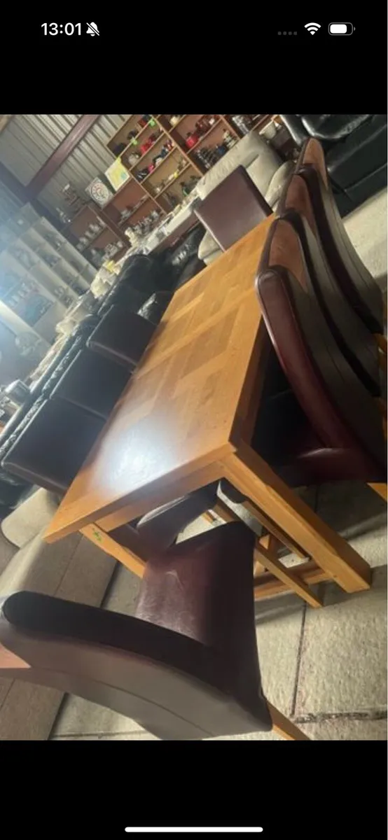 Oak extendable table and 8 chairs - Image 1