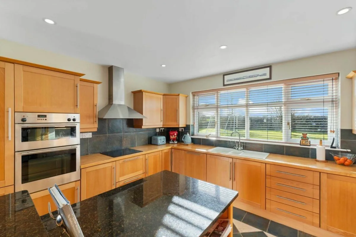 Wood Kitchen with Black Quartz Countertop - Image 2