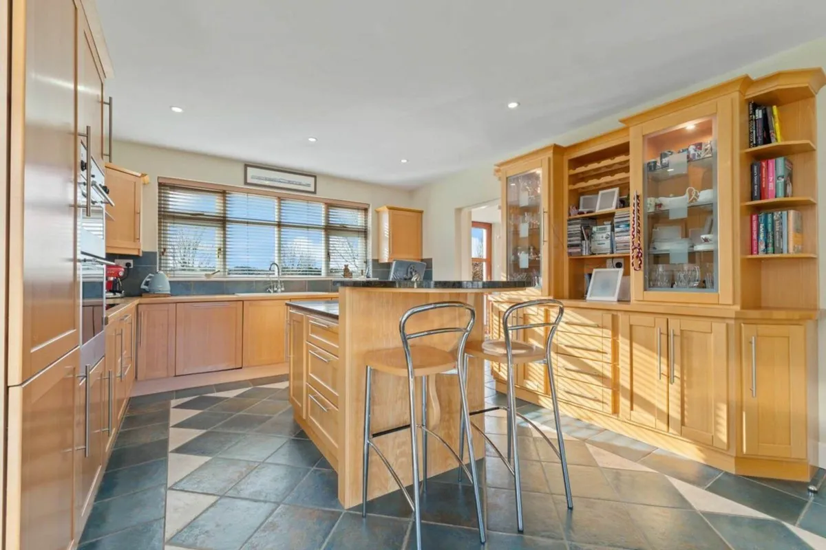 Wood Kitchen with Black Quartz Countertop - Image 4