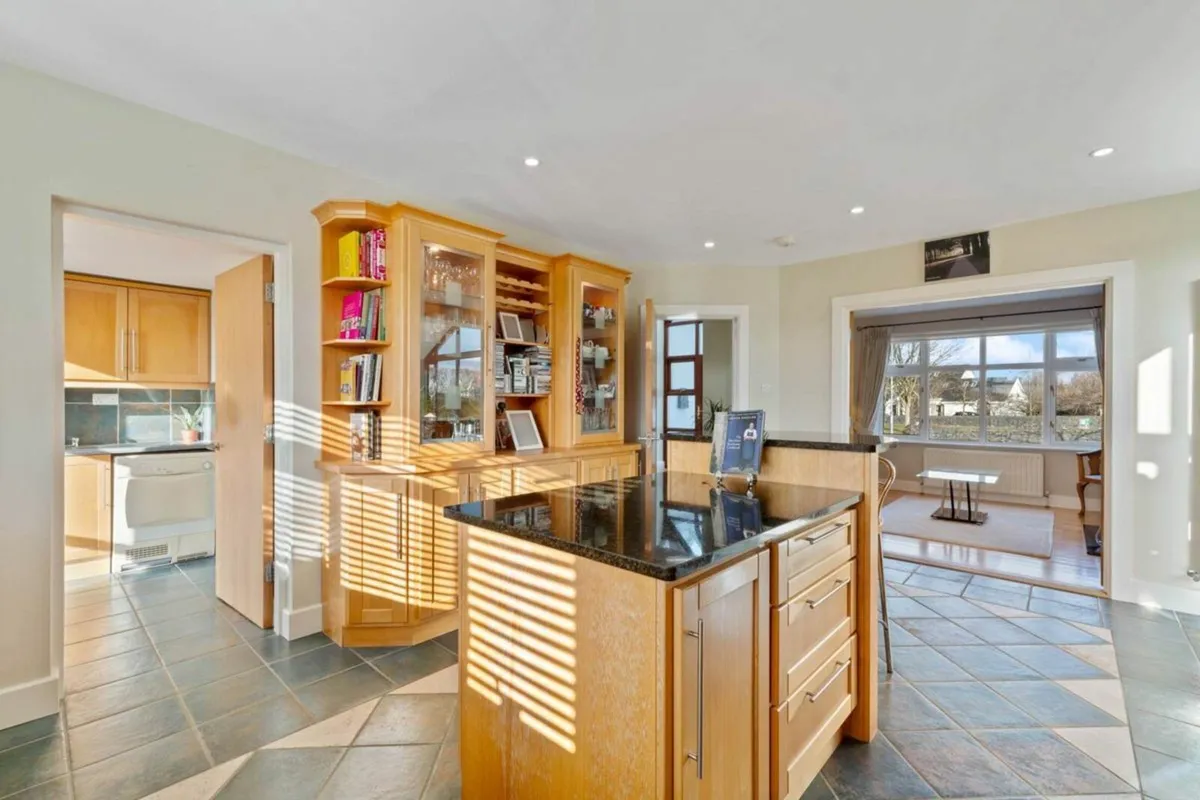 Wood Kitchen with Black Quartz Countertop - Image 1