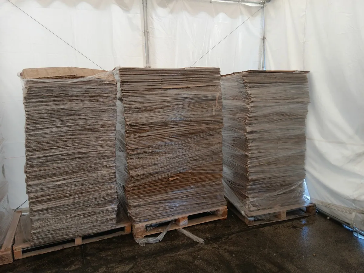 Pallets of flattened cardboard boxes - Image 1