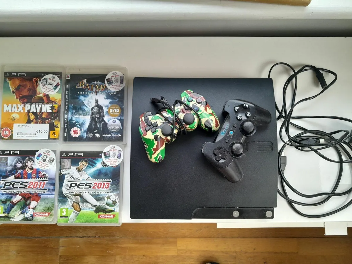 PlayStation 3 Console + 2 Controllers + 4 Games - Image 1