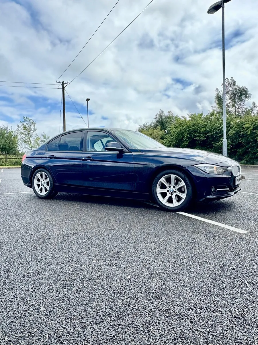 2012 BMW 3 Series - Image 1