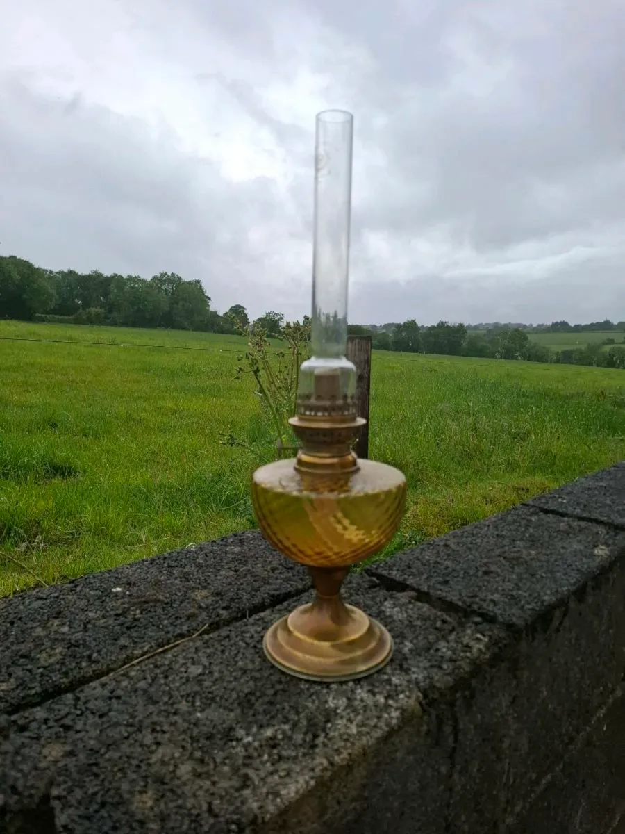 Glass yellow oil lamp postage possible - Image 1