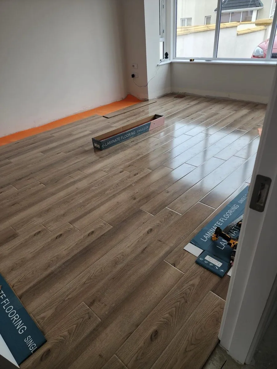 New 12mm High Gloss Beige Laminated Flooring - Image 1