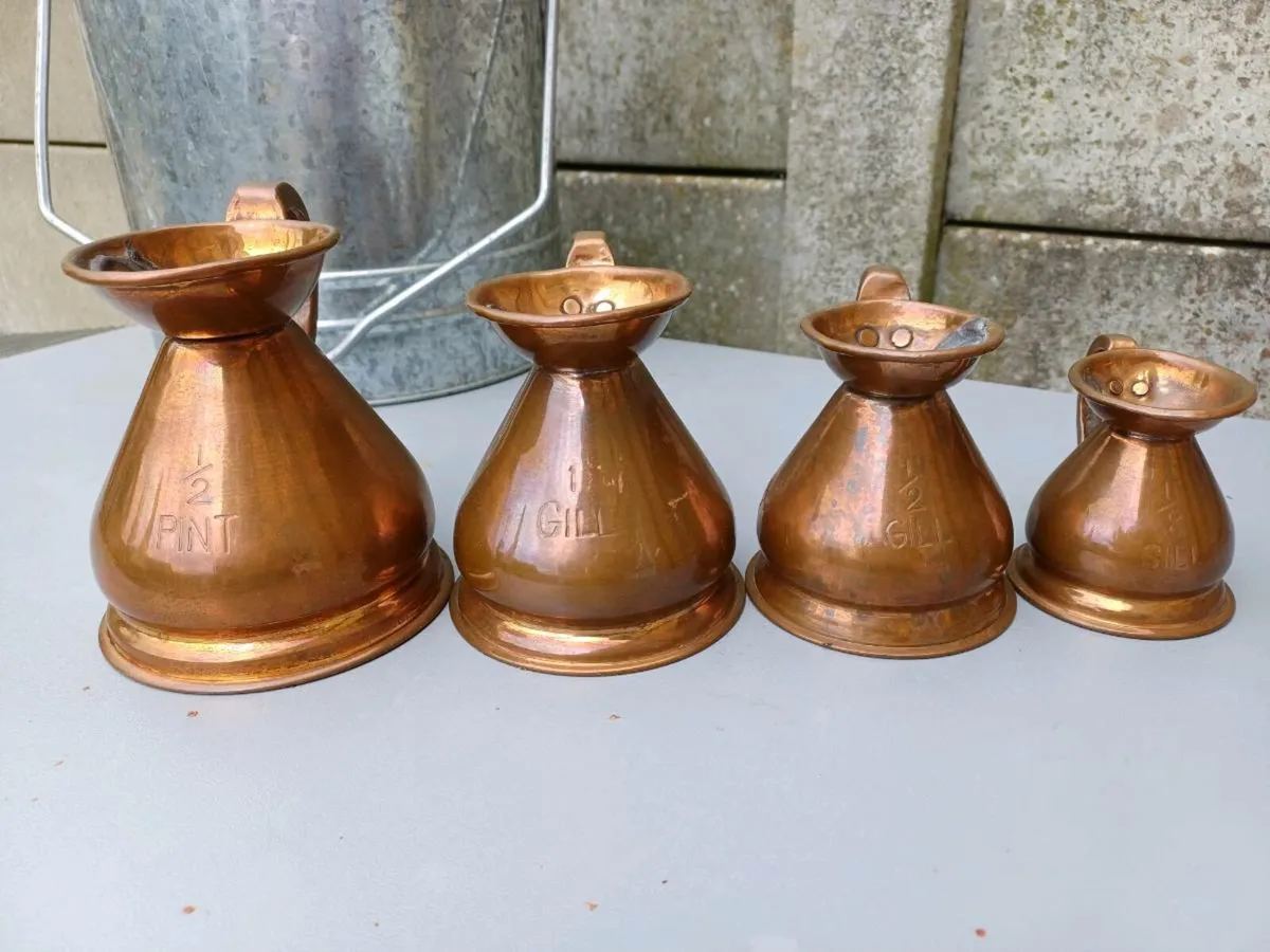 Antique Graduated Copper Jugs - Image 1