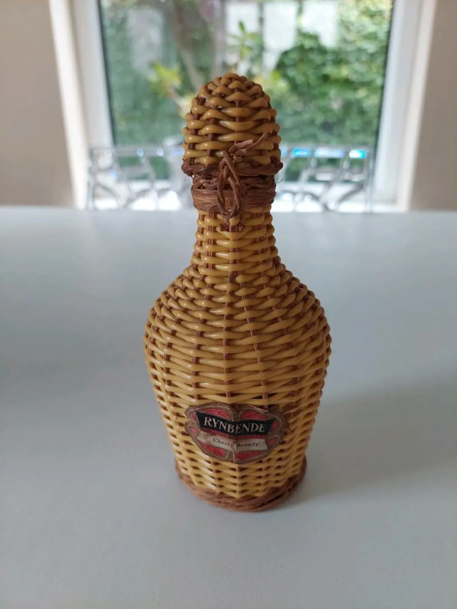 1960s wicker brandy bottle - Image 1