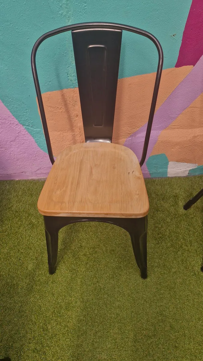 Bolero Chairs. Black metal with wooden seat