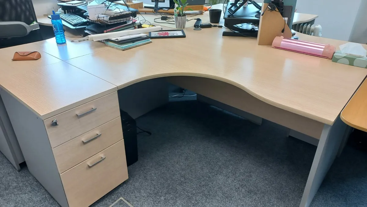 Managers corner office desk with