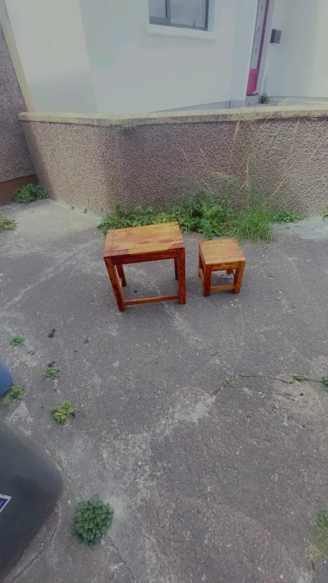 Two solid little tables