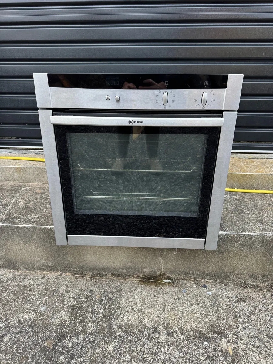 Neff oven with slide and hide door - Image 1
