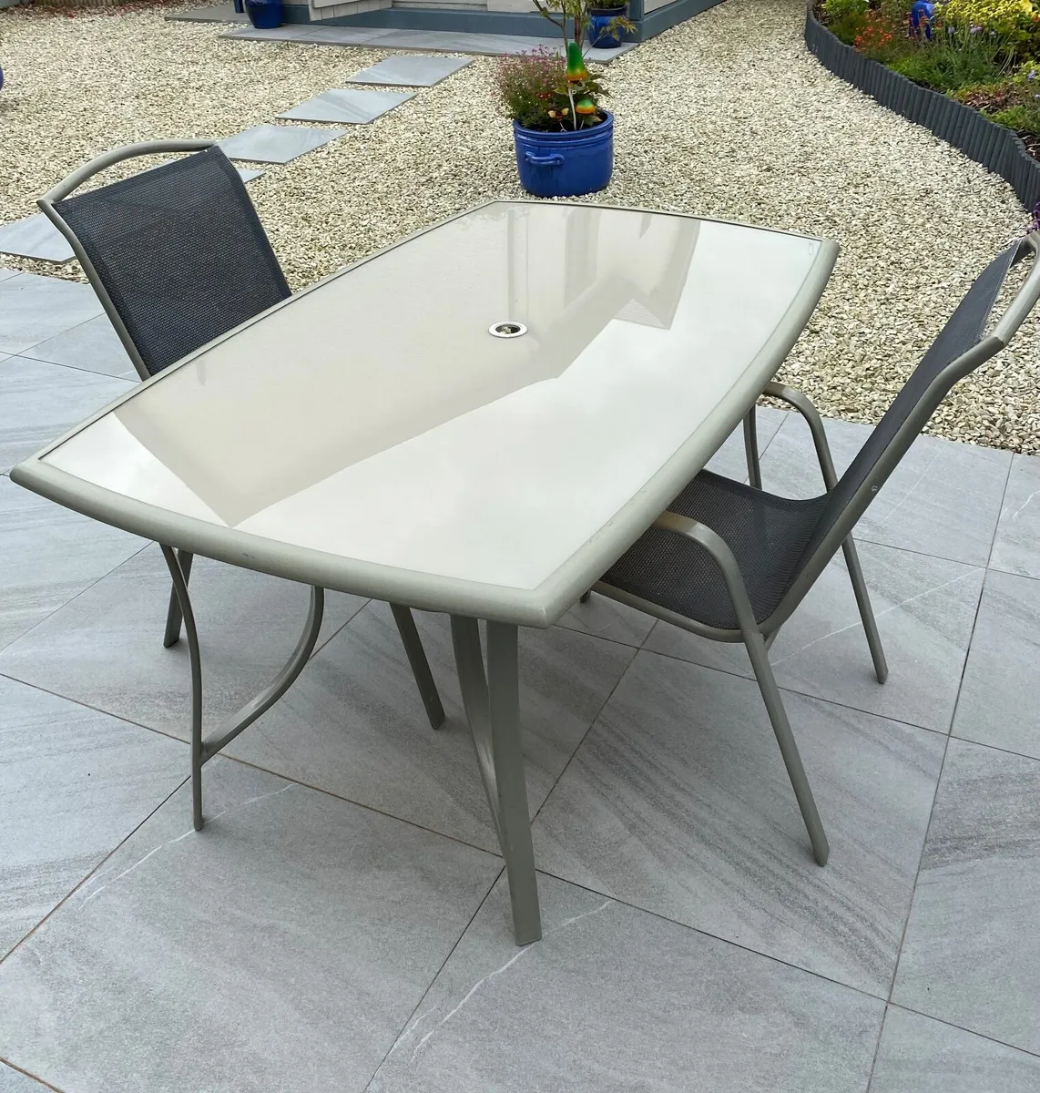 Glass top table and two chairs