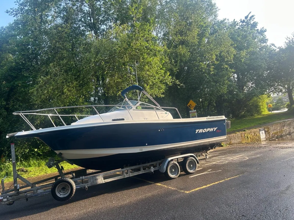 Trophy boat 2352.  New engine and out unit… - Image 1