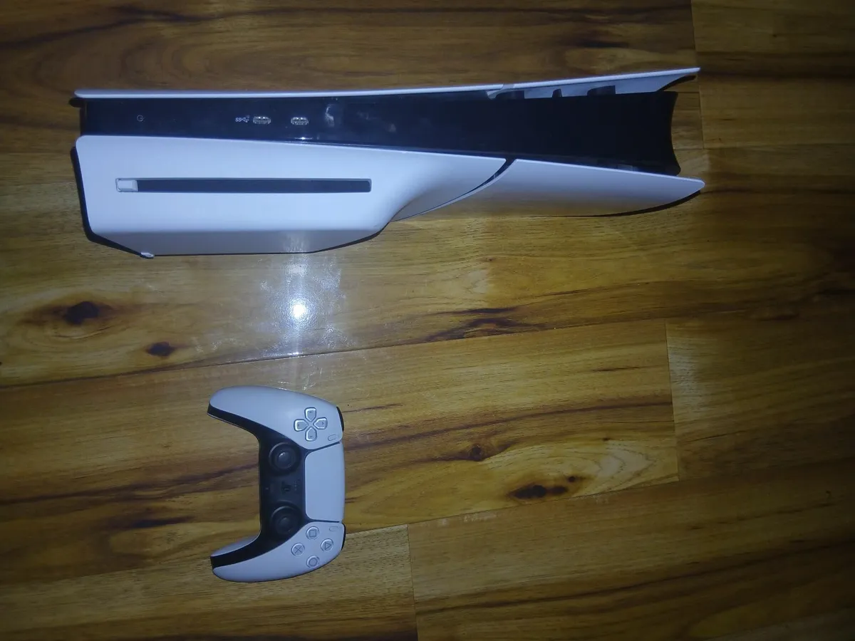Ps5 and a game and controller - Image 1