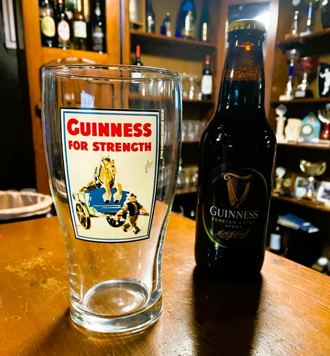 24 Guinness Pint Glasses ' Guinness for Strength' - Image 1