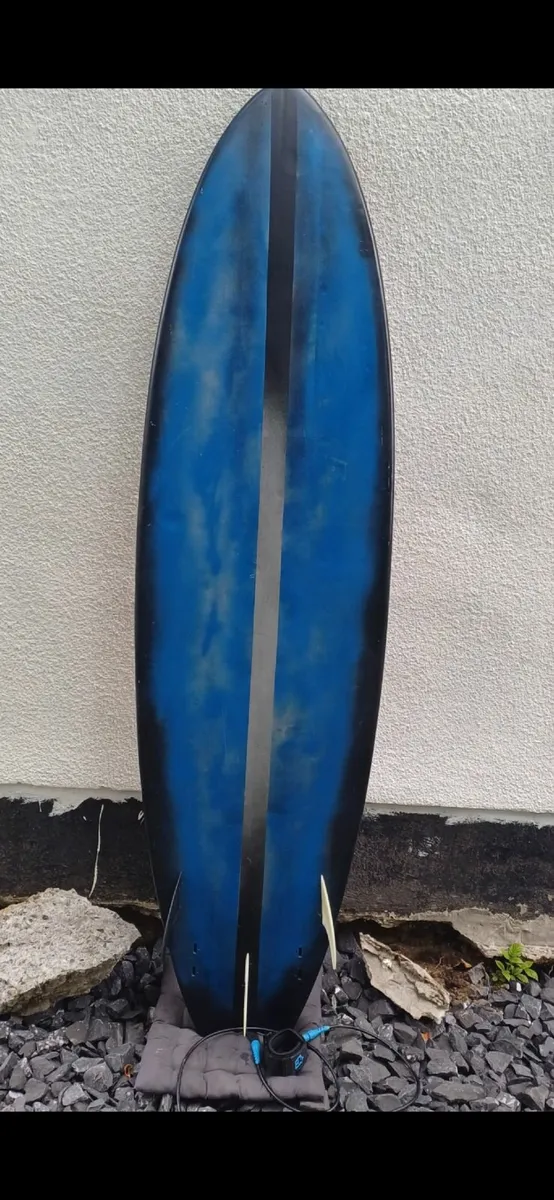 Surfboard and wetsuit fins and leash. - Image 1