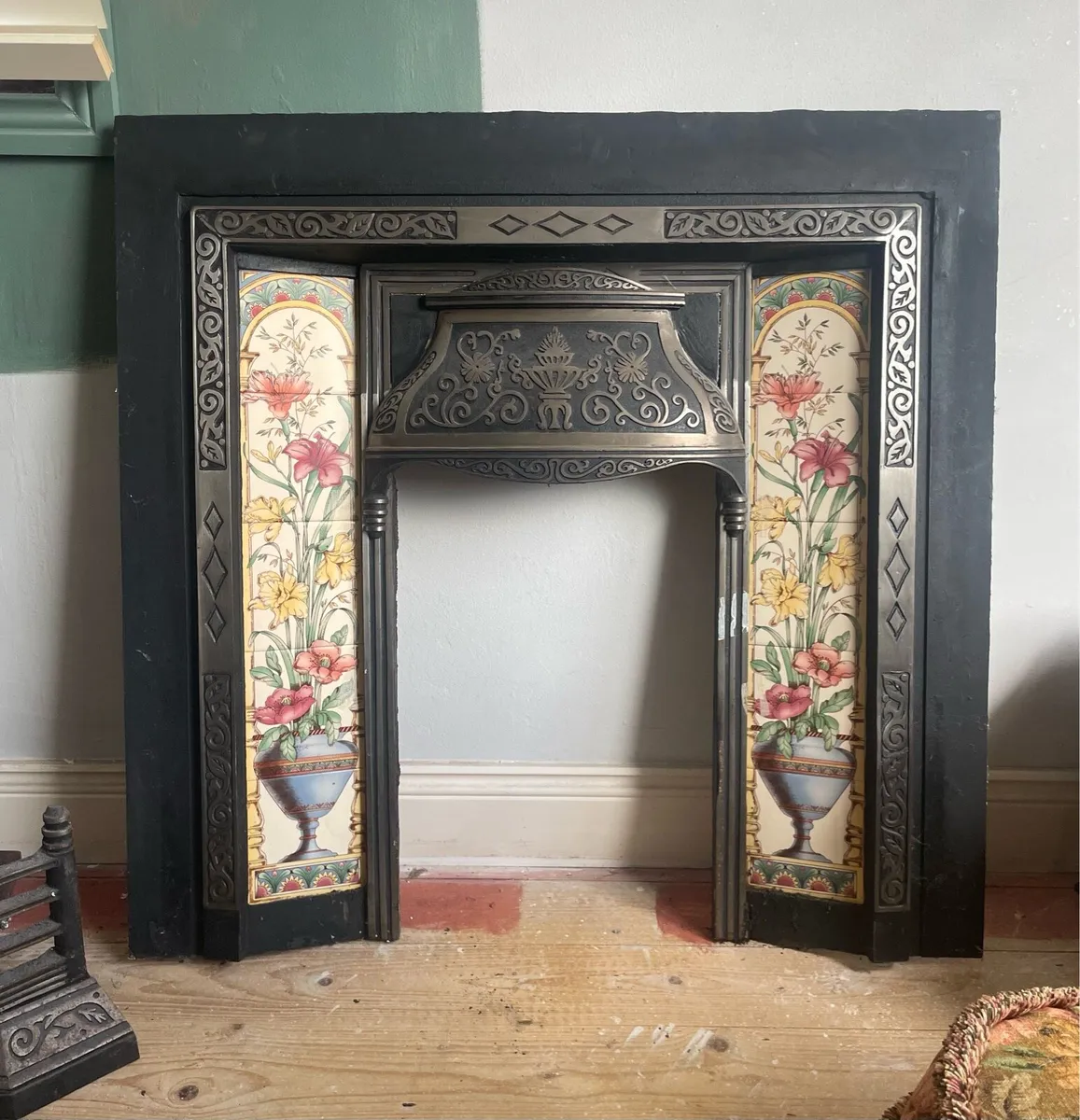 Cast iron fireplace surround with tiled detail - Image 1