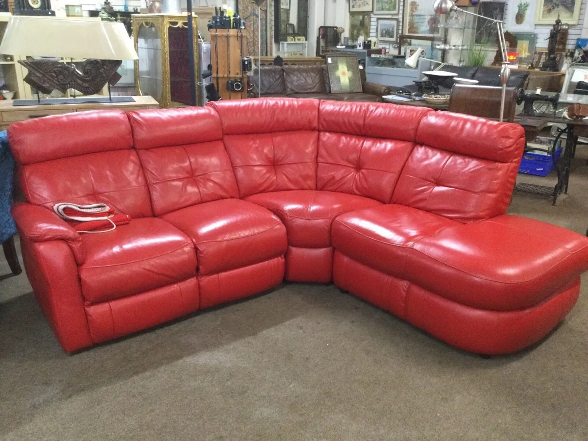 A beautiful lipstick red electric corner sofa