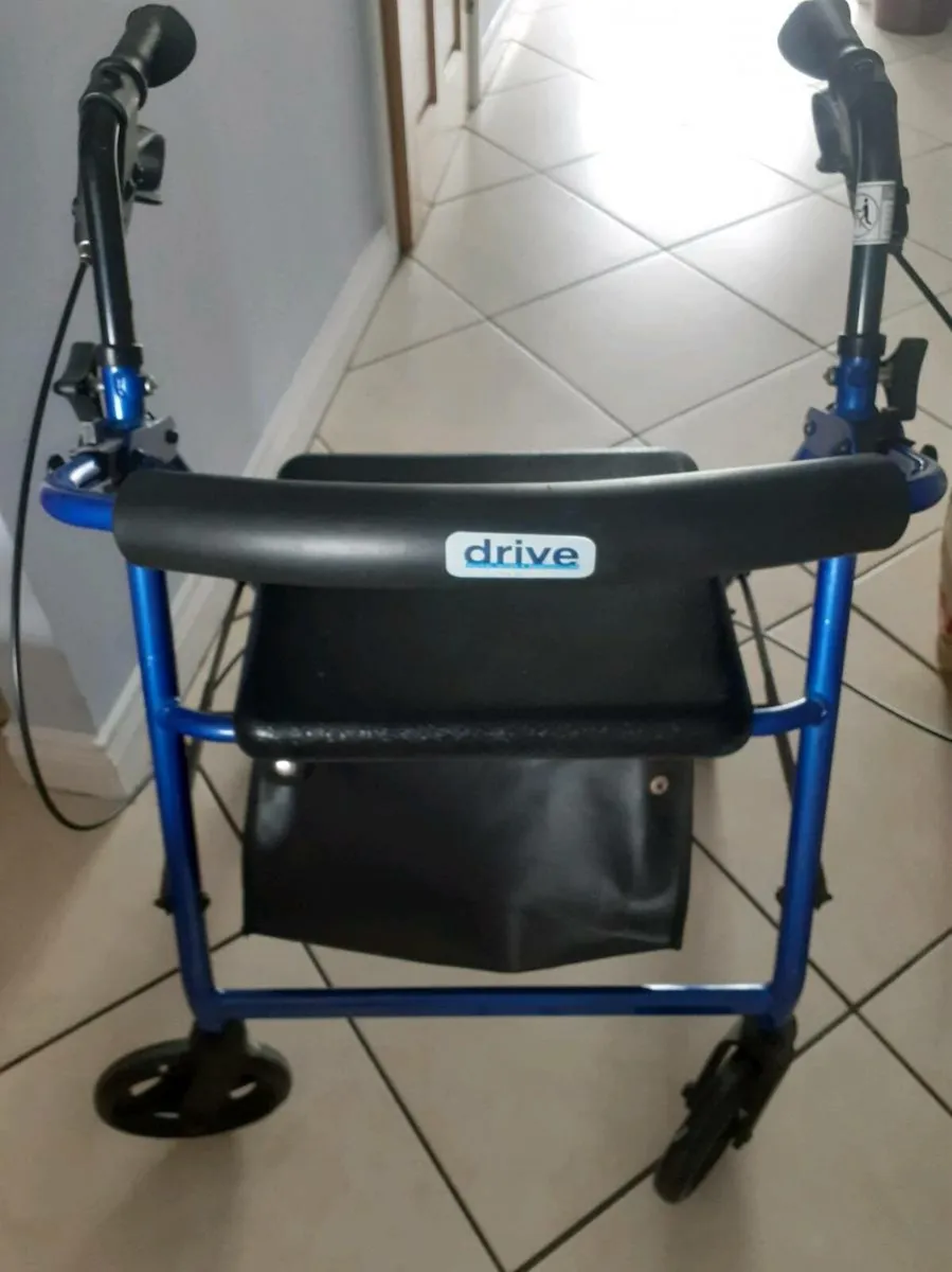 Rollator walker with seat and storage bag - Image 1