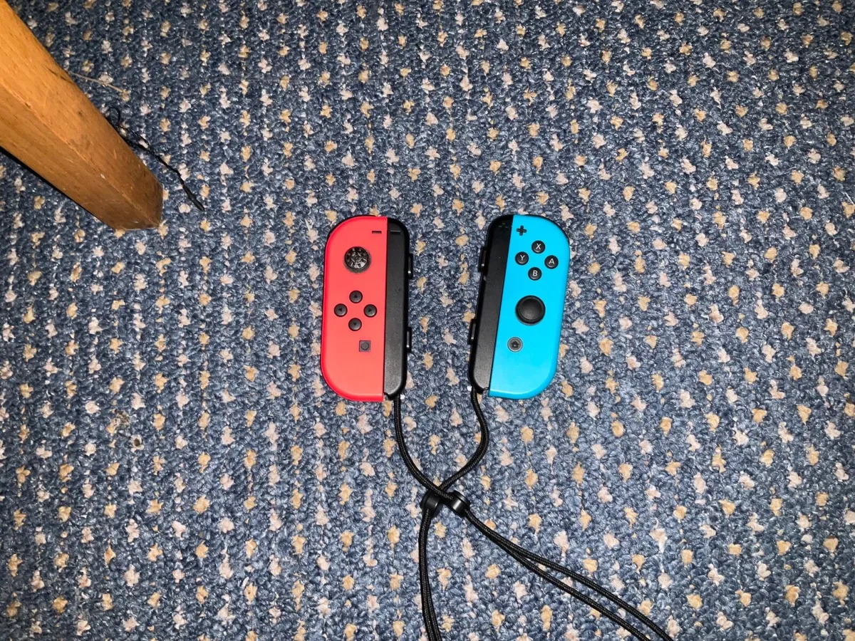 Nintendo Switch with Joy Con straps and case - Image 4