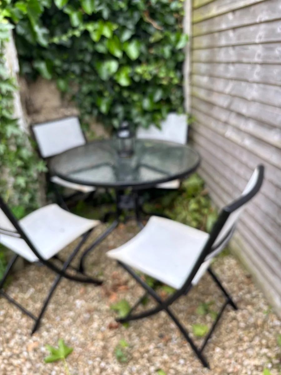 Garden table & 4 chairs.