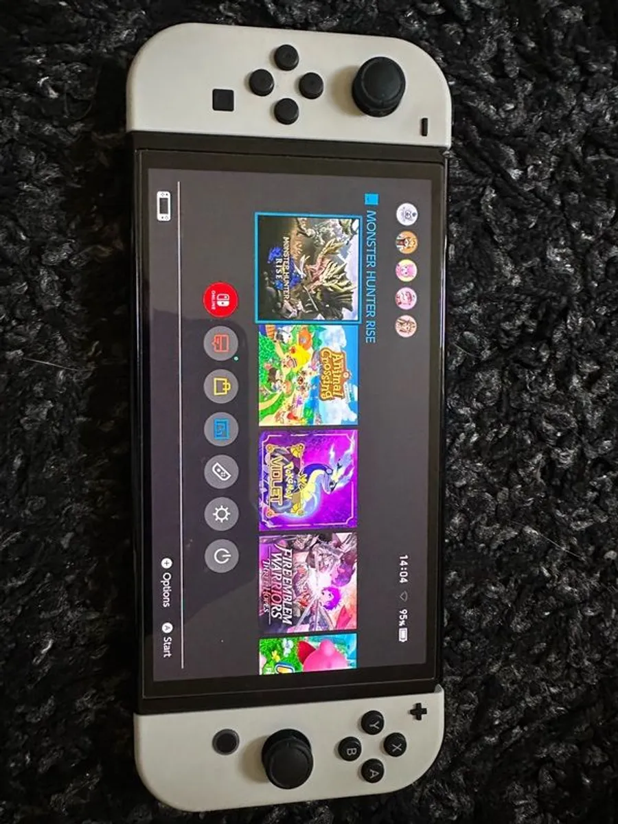 Nintendo Switch OLED (White) + 4 Popular Games - Image 1