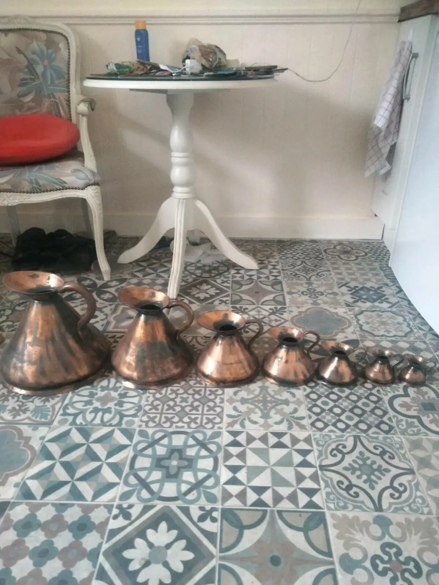 Seven Copper Jugs - Image 1