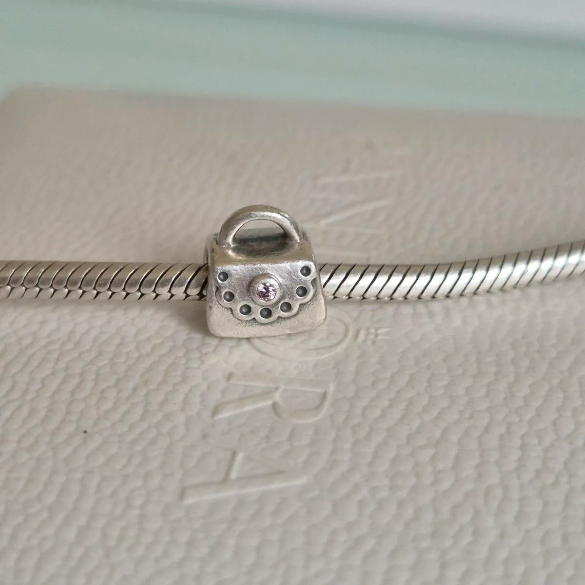 Pandora charm bag with stone pink in great used co - Image 1