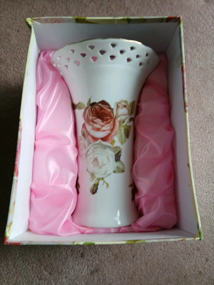 10 inch tall vase "Antique rose" brand.