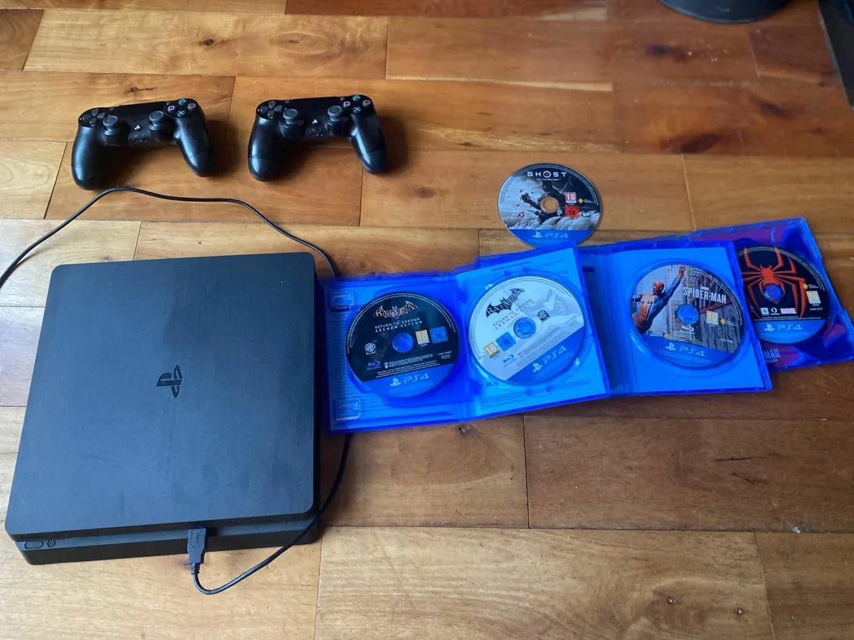 PS4 Slim with Games and Controllers