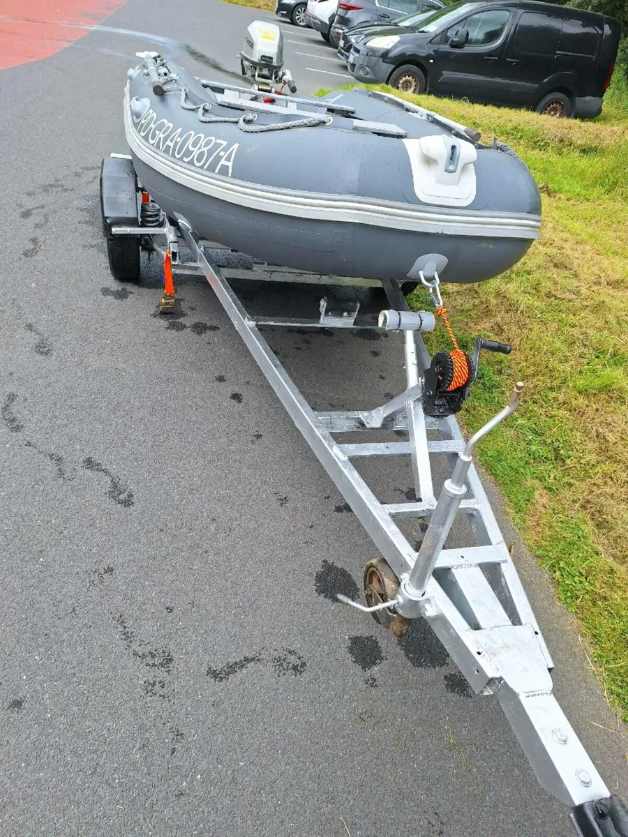 Inflatable boat, engine and trailer. - Image 1