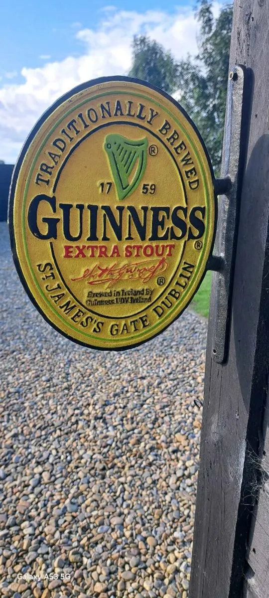 Guinness  2 sided  cast iron sign - Image 1