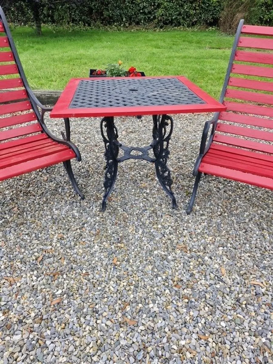 Heavy cast iron table and two high back chairs - Image 3