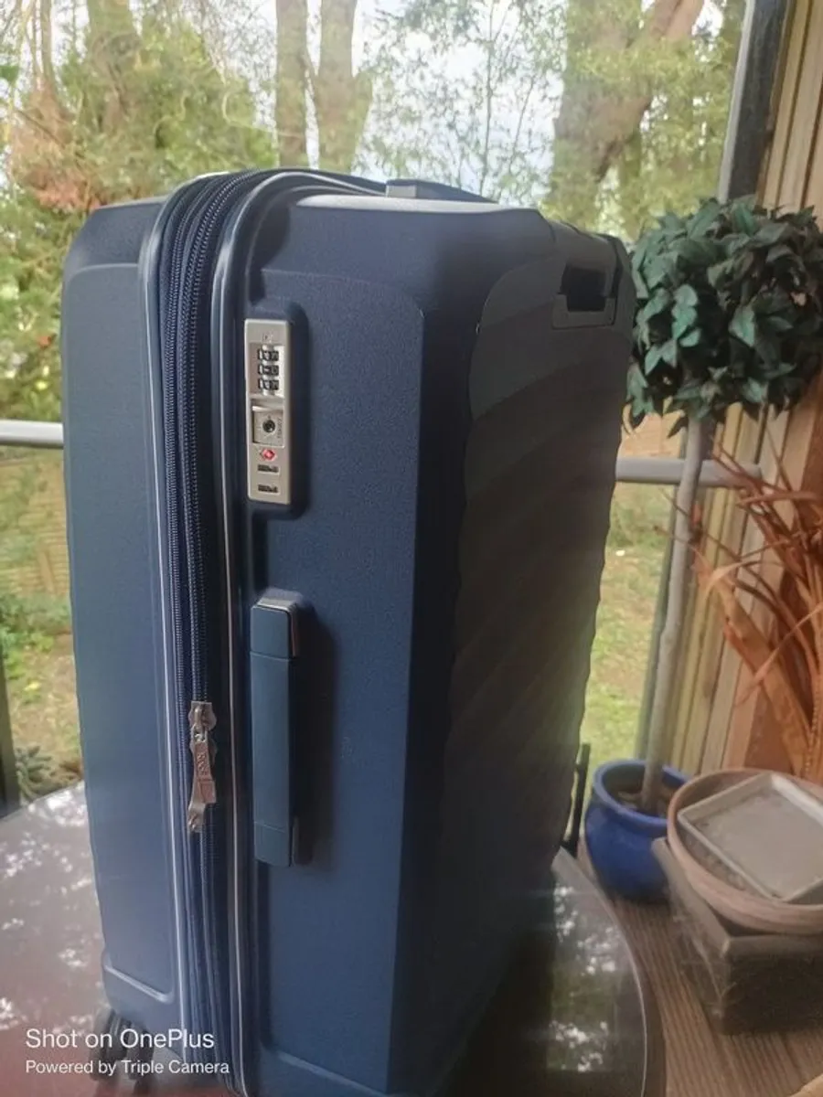 Hard shell suitcase for sale. - Image 1