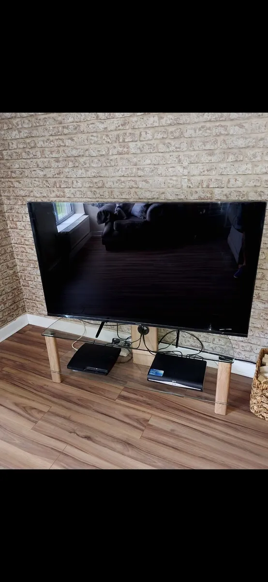 Panasonic 58 inch TV with PS3 and Stand included.