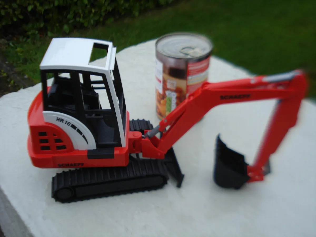 BRUDER SCHAEFE HR16 MINI EXCAVATOR. 1/16 SCALE. - Image 1