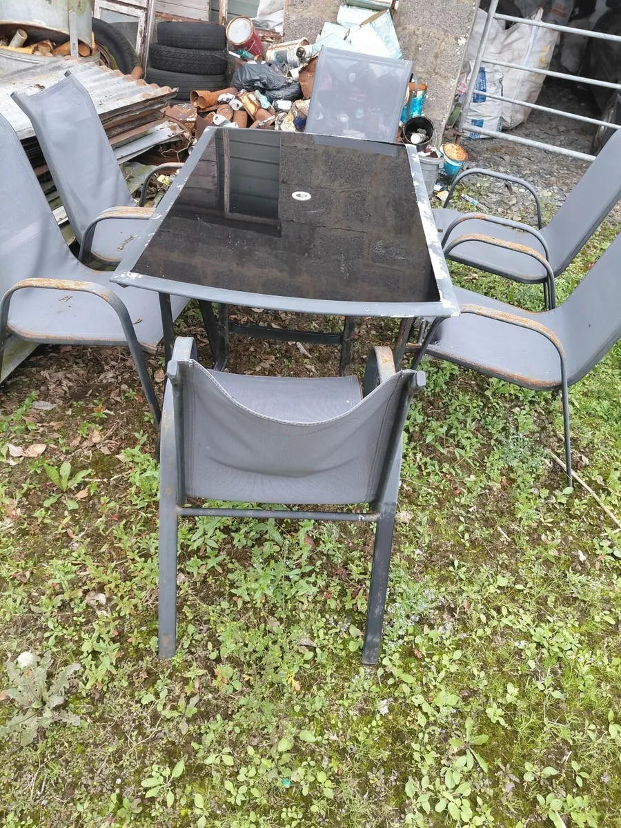 Sheets of galvanise garden table and chairs - Image 1