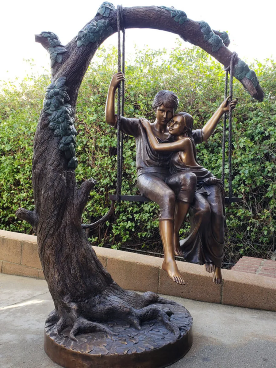 Bronze lovers on tree sculpture - Image 1
