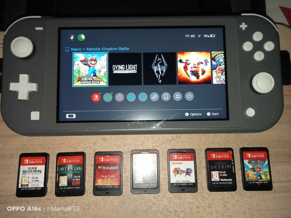 Nintendo switch Lite + 7 Game Cartridges + Case - Image 1